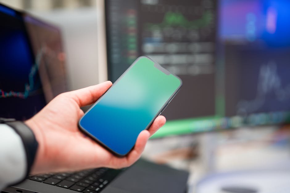 Mobile phone showing a business website with phone number clearly visible in the header