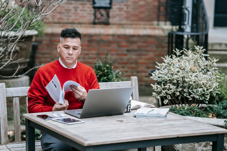 Landscaper reviewing their business website on a tablet while on a job site